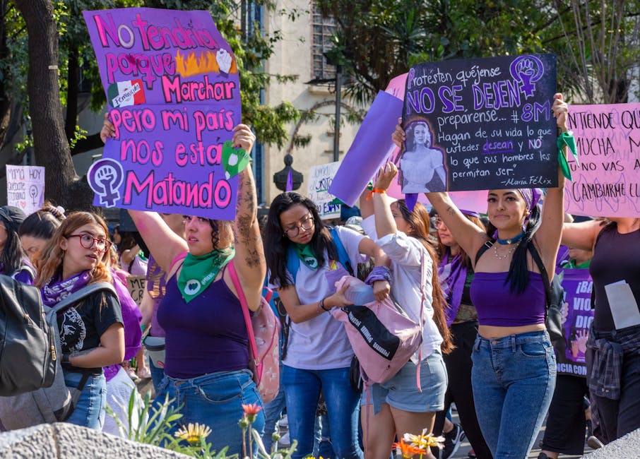Crowd of marchers holding signs on the steps of the Humboldt County Courthouse in Eureka